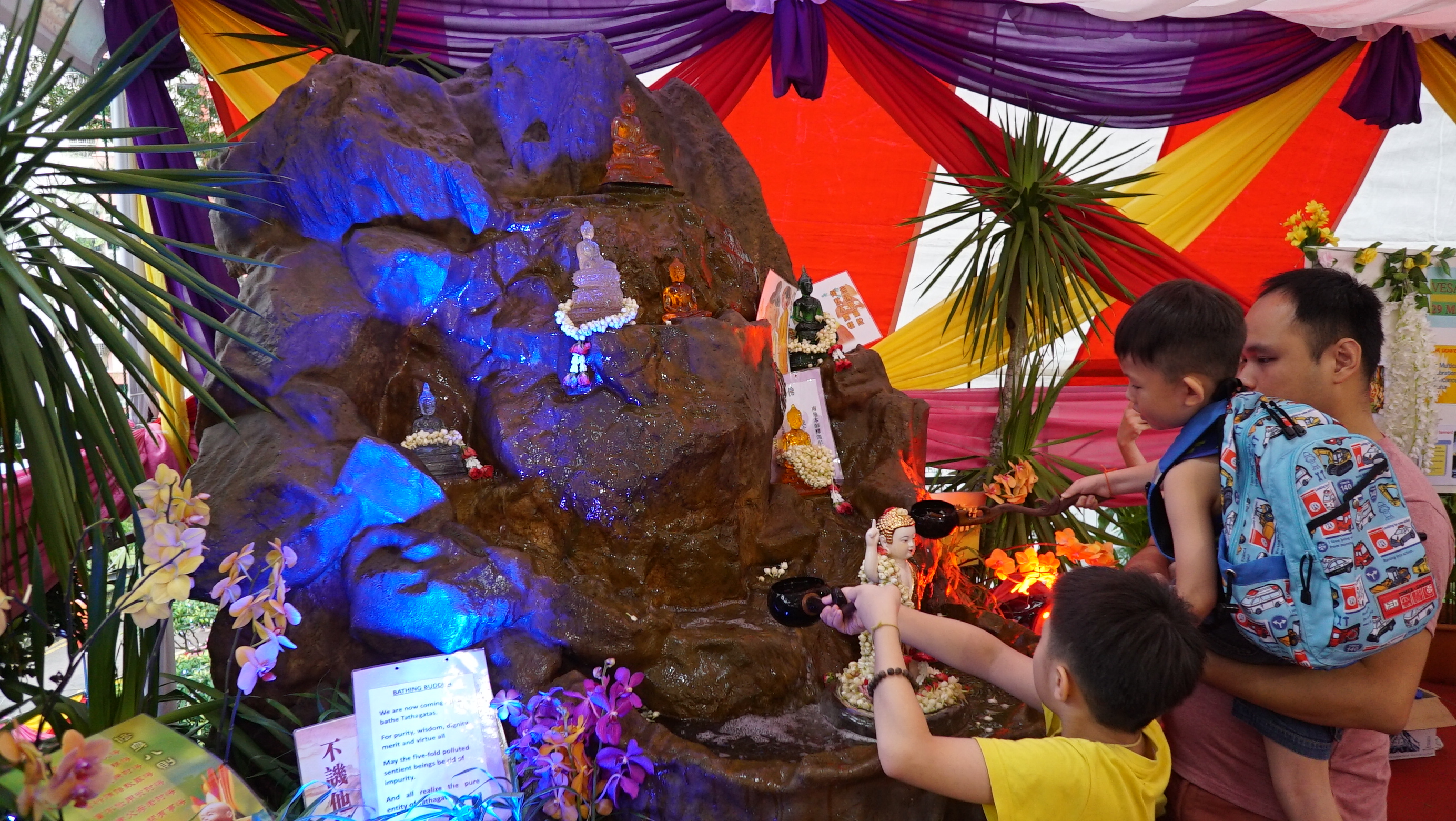 Bathing the Buddha is a common practice during Vesak Day, where water is poured over a statue of Buddha. The act is linked to the legend of Buddha being consecrated by the waters of nine mythical dragons after his birth. 