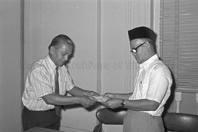 Ahmad Ibrahim receiving a cheque