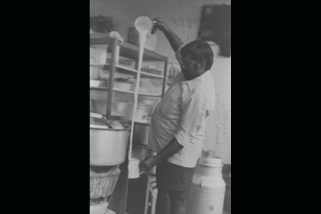 An Indian teh sarabat stall proprietor