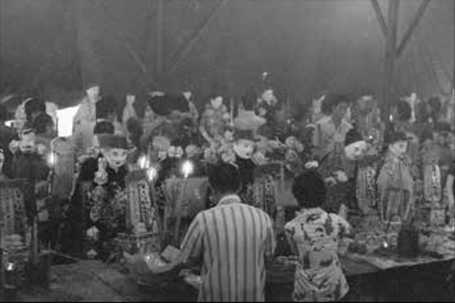 Family members praying to their ancestors