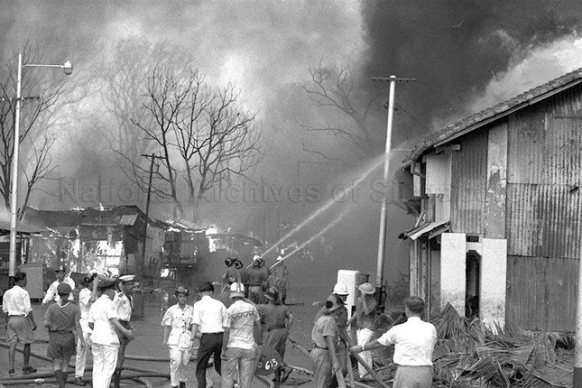 Firefighters putting out the fire in Bukit Ho Swee