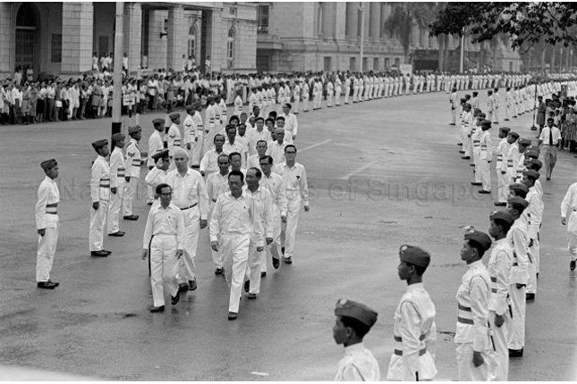 Dr Goh Keng Swee walks alongside fellow Cabinet members towards Parliament in 1963