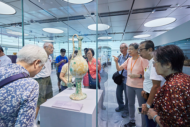 Interactions with the museum’s visitors energises Wen Sze, who is always ready to answer questions about the museum’s collections.