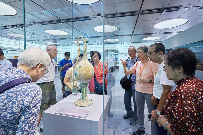Interactions with the museum’s visitors energises Wen Sze, who is always ready to answer questions about the museum’s collections.