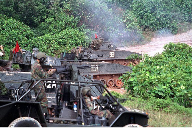 Reservist NS Men conducting live firing exercise