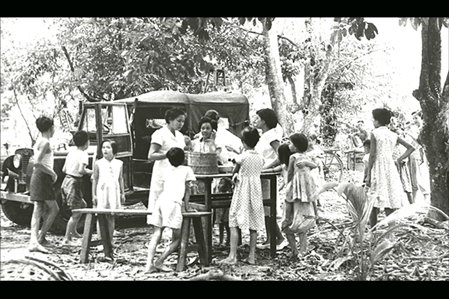 A mobile immunisation team on a regular visit to a kampong (village). Bringing healthcare to rural areas was aided by the donation of a mobile dispensary from the Rotary Club of Singapore in 1947. (1950).
