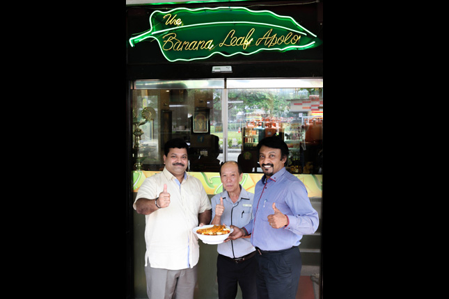 Appollo Group CEO C Sankaranathan (left) with V Vijaykumarr and a staff of Banana Leaf Apolo