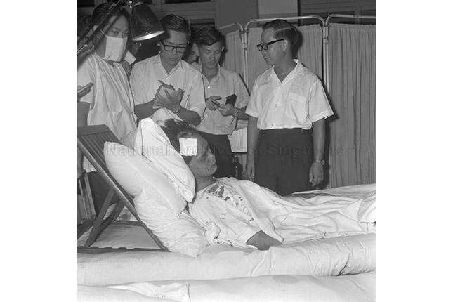 Deputy Prime Minister Toh Chin Chye visits victims of the MacDonald House bombing