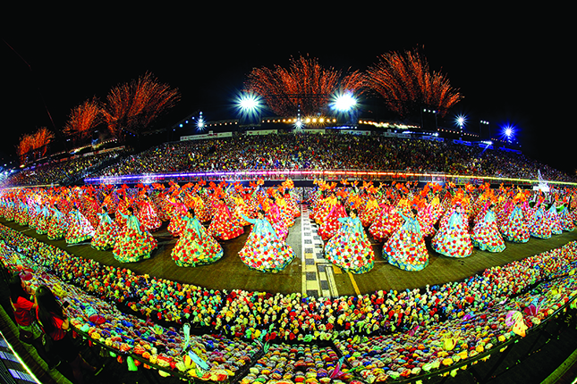Chingay Parade 2015: “One million “We Love SG Flowers” were made by residents from all around Singapore as part of SG50 and were on display and also sewn onto costumes worn by performers in the opening act.” Image credits: People's Association