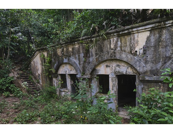 From the early 19th century, the hills of Siloso and Serapong, standing watch over the western and eastern approaches to Singapore respectively, had been identified as suitable sites for military fortifications. Mount Serapong was also the highest point on Blakang Mati, reaching 92 metres at its summit. An infantry redoubt thought to have been completed in the early 1880s was the first defensive work here. In the early 1880s, the British War Office approved a new battery on Serapong, which became operational in 1887.