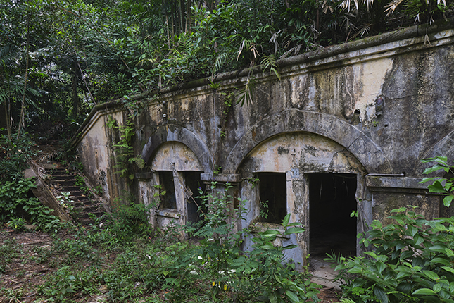 From the early 19th century, the hills of Siloso and Serapong, standing watch over the western and eastern approaches to Singapore respectively, had been identified as suitable sites for military fortifications. Mount Serapong was also the highest point on Blakang Mati, reaching 92 metres at its summit. An infantry redoubt thought to have been completed in the early 1880s was the first defensive work here. In the early 1880s, the British War Office approved a new battery on Serapong, which became operational in 1887.