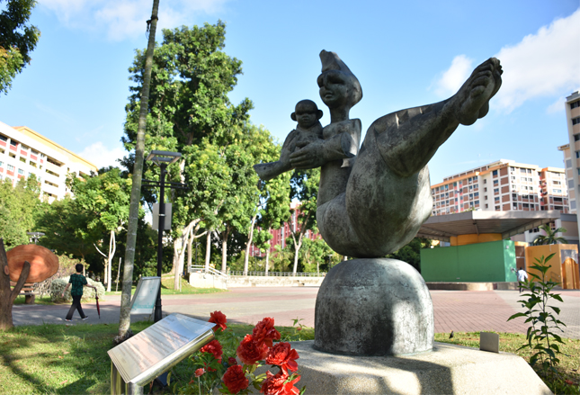 Sculpture by renowned Singapore artist and Cultural Medallion recipient, Ng Eng Teng (1934-2001). This bronze sculpture is one of the iconic Mother and Child works created by Ng, whose artworks were known to explore the human condition.