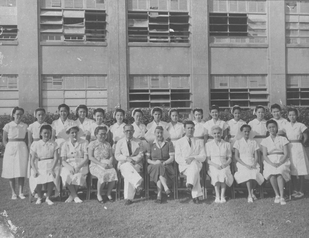 Dr Benjamin H. Sheares (first row, fourth from right) with nursing staff in front of Block 3, 1950. Courtesy of the National Archives of Singapore.