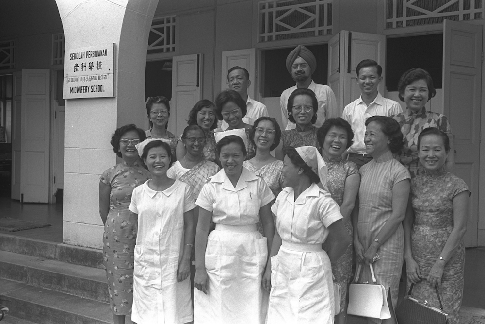 Group photograph taken outside the former School of Midwifery, 15 August 1964. Courtesy of the National Archives of Singapore.