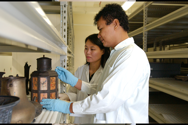 Conservators with artefact