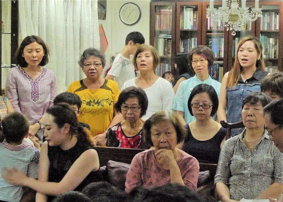 Members sing Chinese hymns during a meeting. Image courtesy of National Heritage Board.