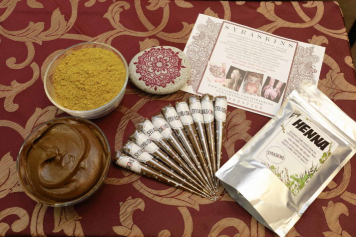 Henna powder, paste and cones.