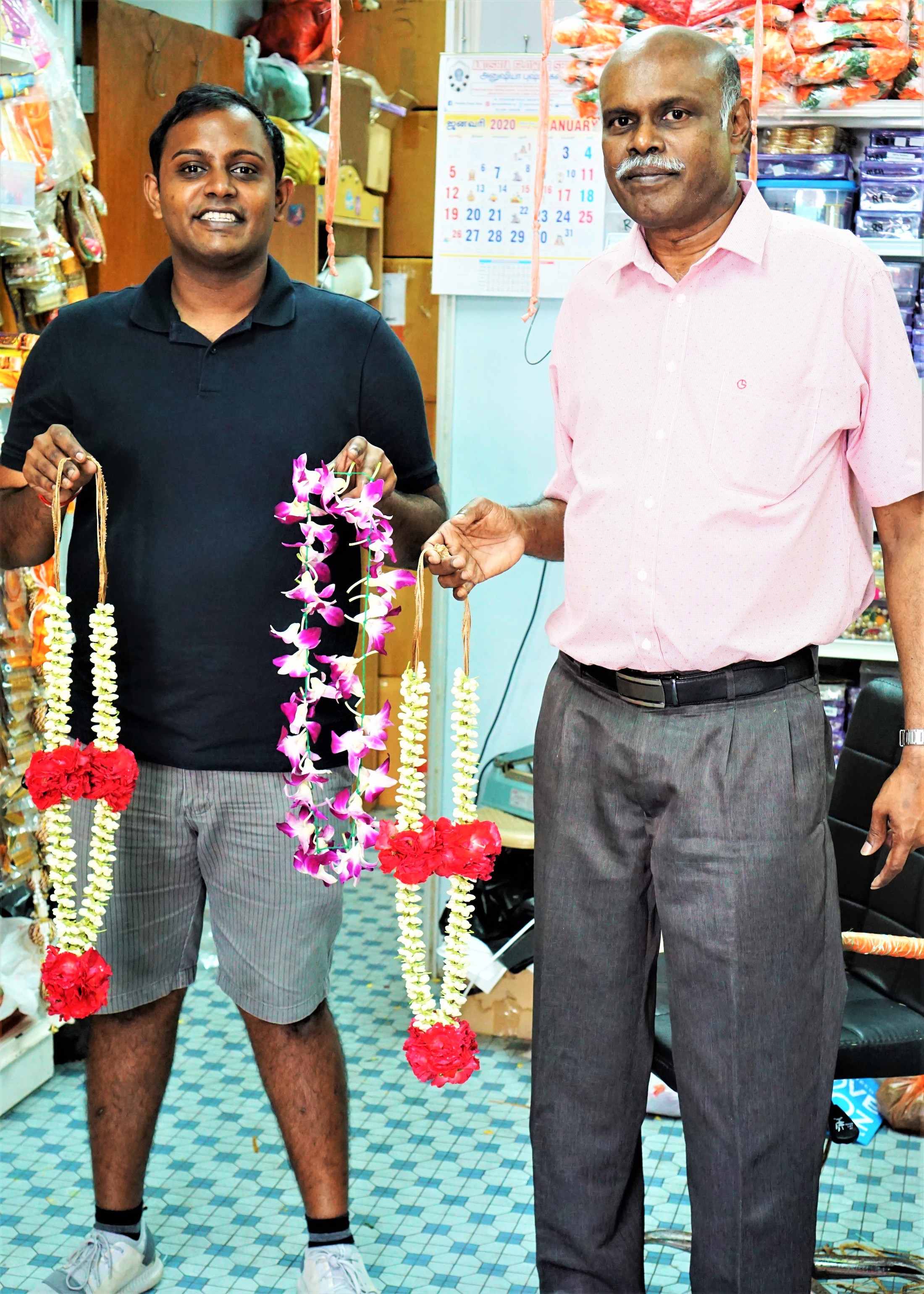 Jasmine and orchid flowers are among the variety of flowers used to make garlands. Image of National Heritage Board.