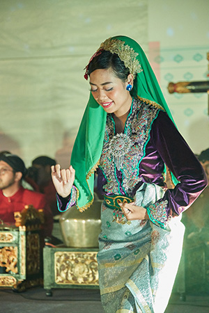 A dancer dances gracefully to the music. Image courtesy of National Heritage Board.