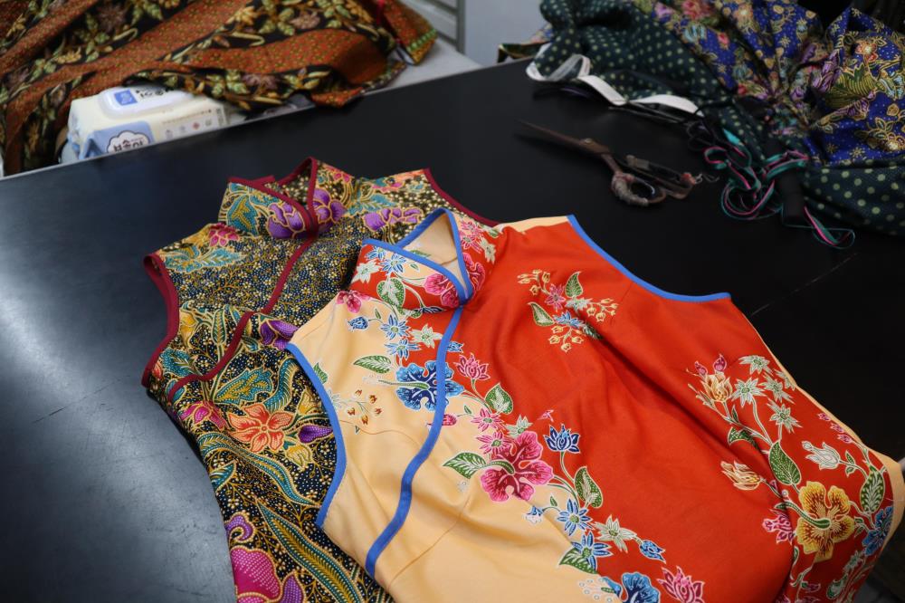 Cheongsams made from batik cloth reflect regional influences, and the garment’s versatility.