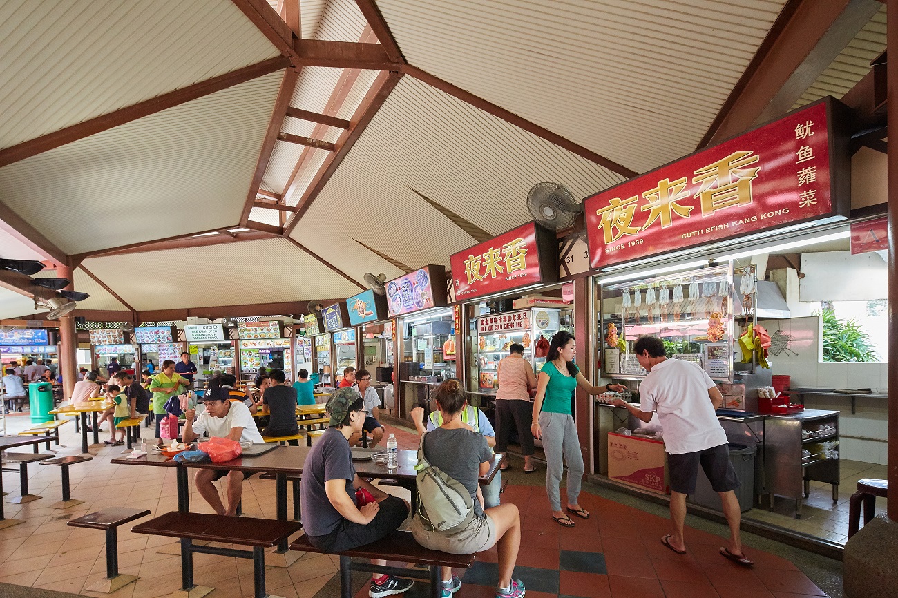 Residents exchanging conversations over a meal at Bedok Food Centre.