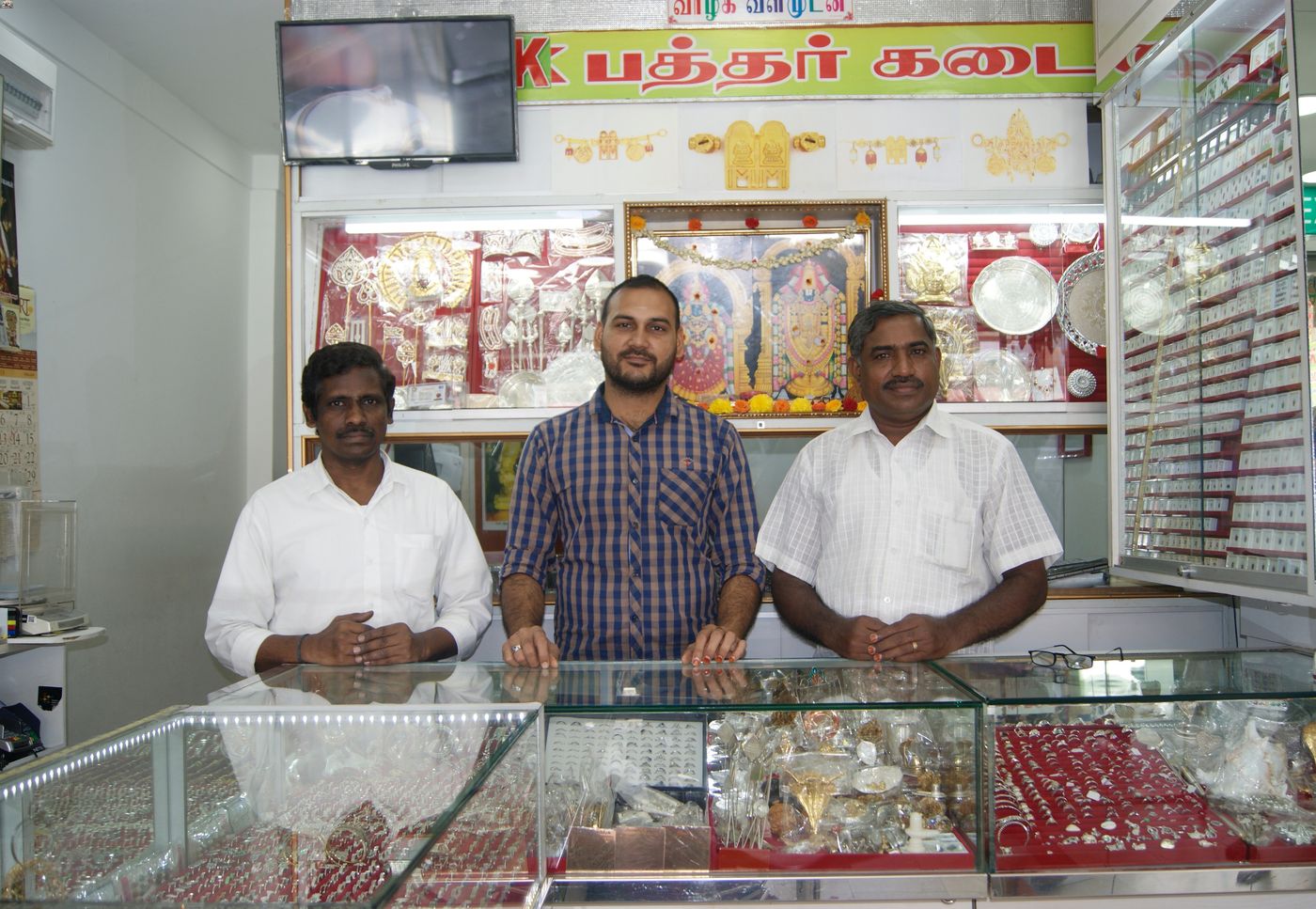 Mr Shanmugam Kasinathan (extreme right), goldsmith and owner of ASK Jewellery, with his employees. Mr Kasinathan still crafts jewellery by hand instead of relying on machine-made jewellery from factories. 