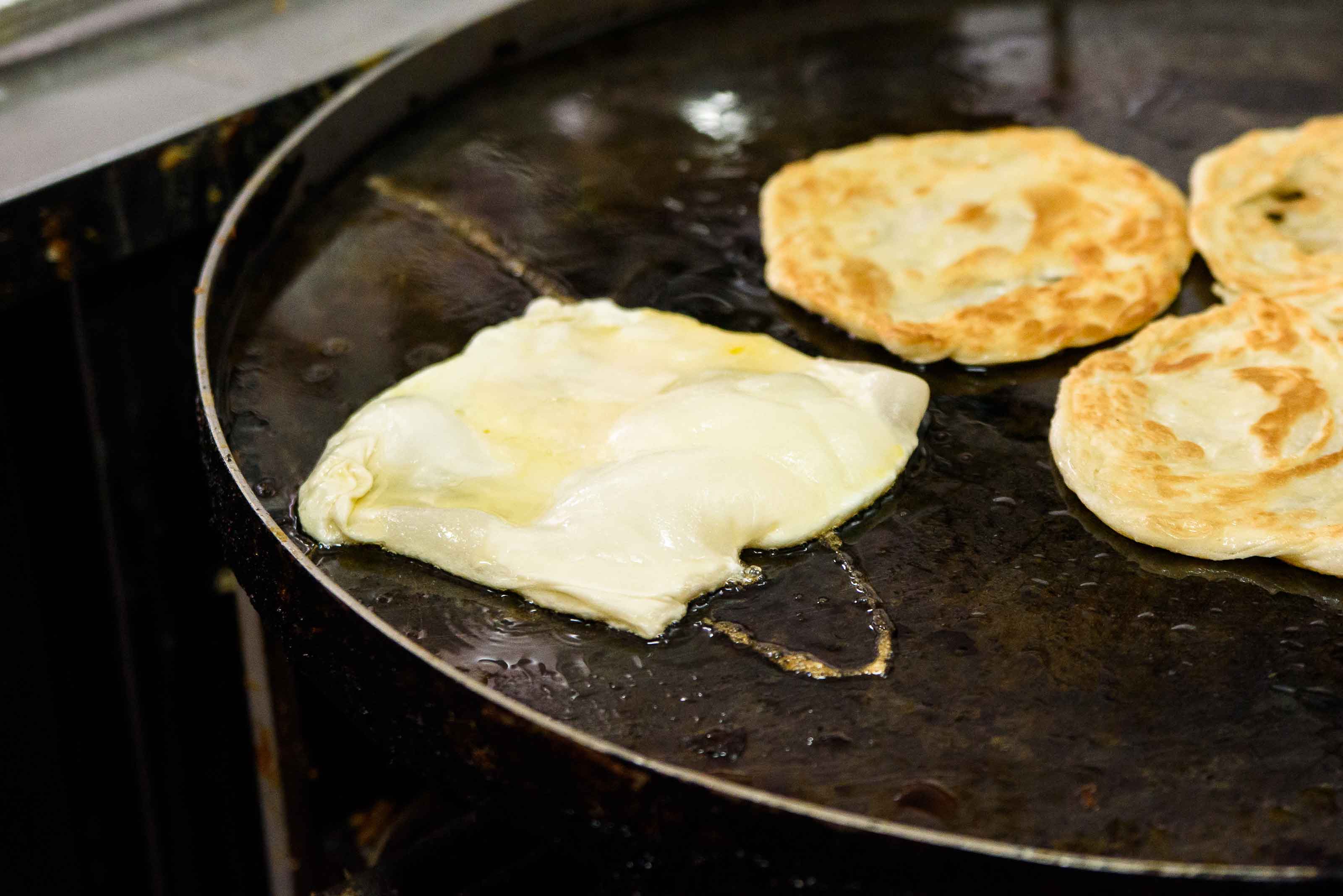 Prata being fried.