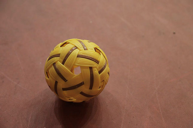 A tournament-grade sepak takraw ball, made of synthetic rubber, that is usually used in national tournaments.