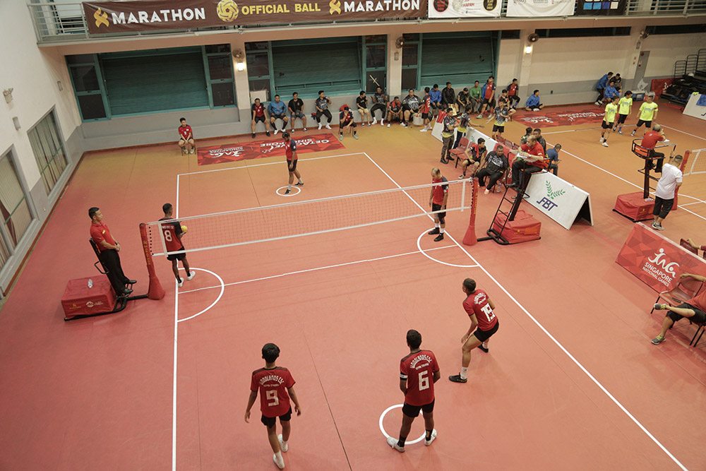 Action in a sepak takraw game, involving designated “killers” (or strikers) in the midst of kicking the ball into opponents’ courts.