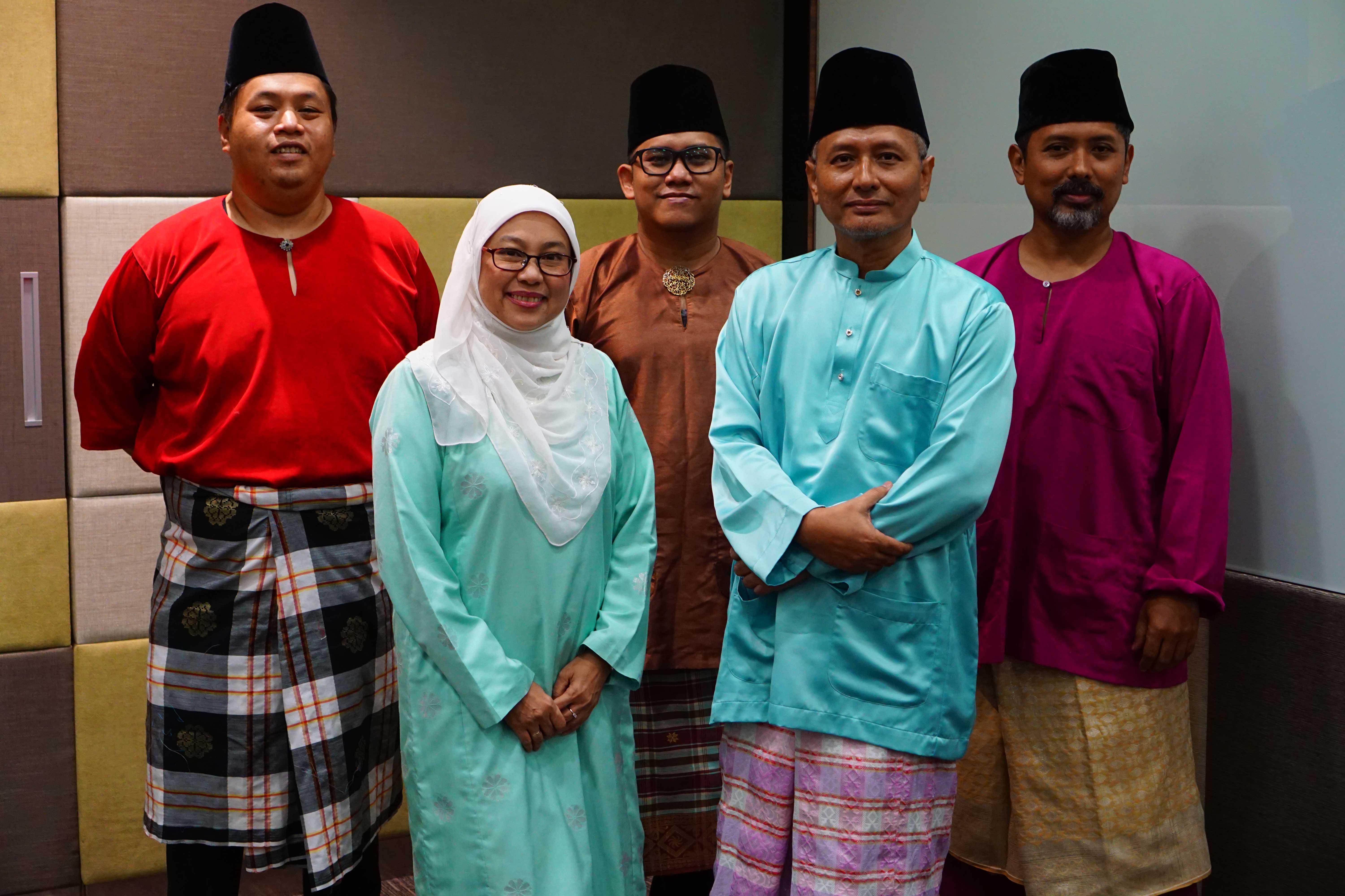 Mr Ariffin Omar (second from right), bandleader of the traditional Malay ensemble Sri Mahligai, with the other band members.