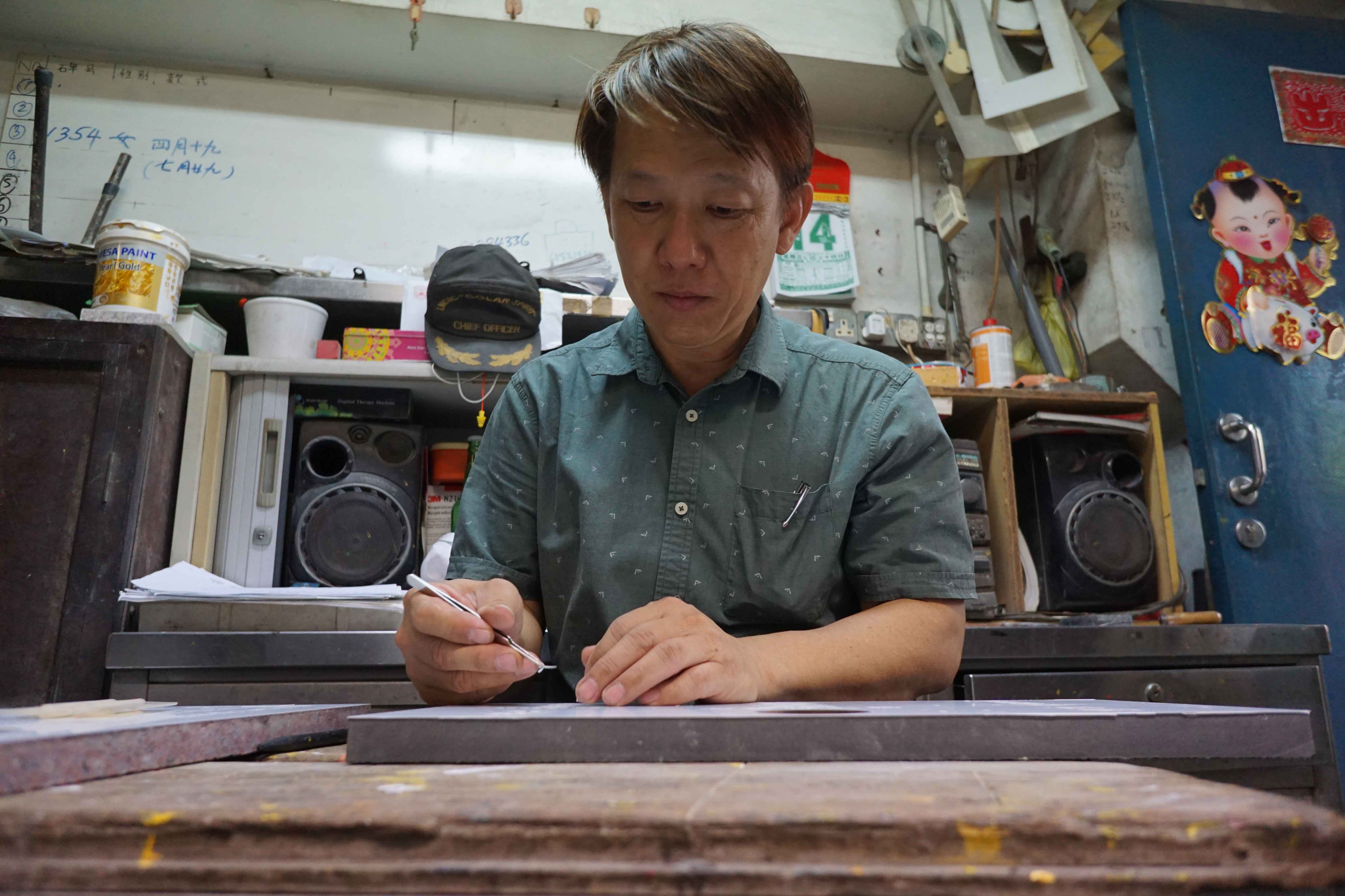Mr Raymond Toh at work in his office