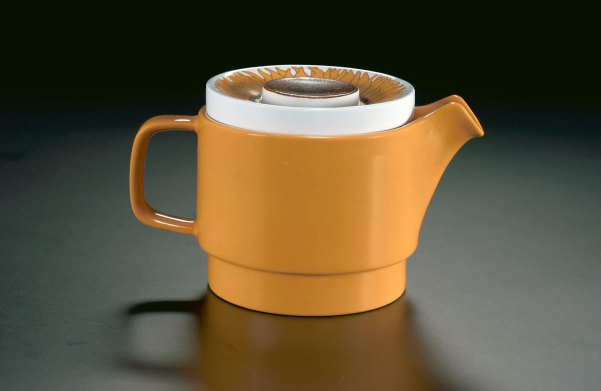 Plastic covered teapot from a breakfast set