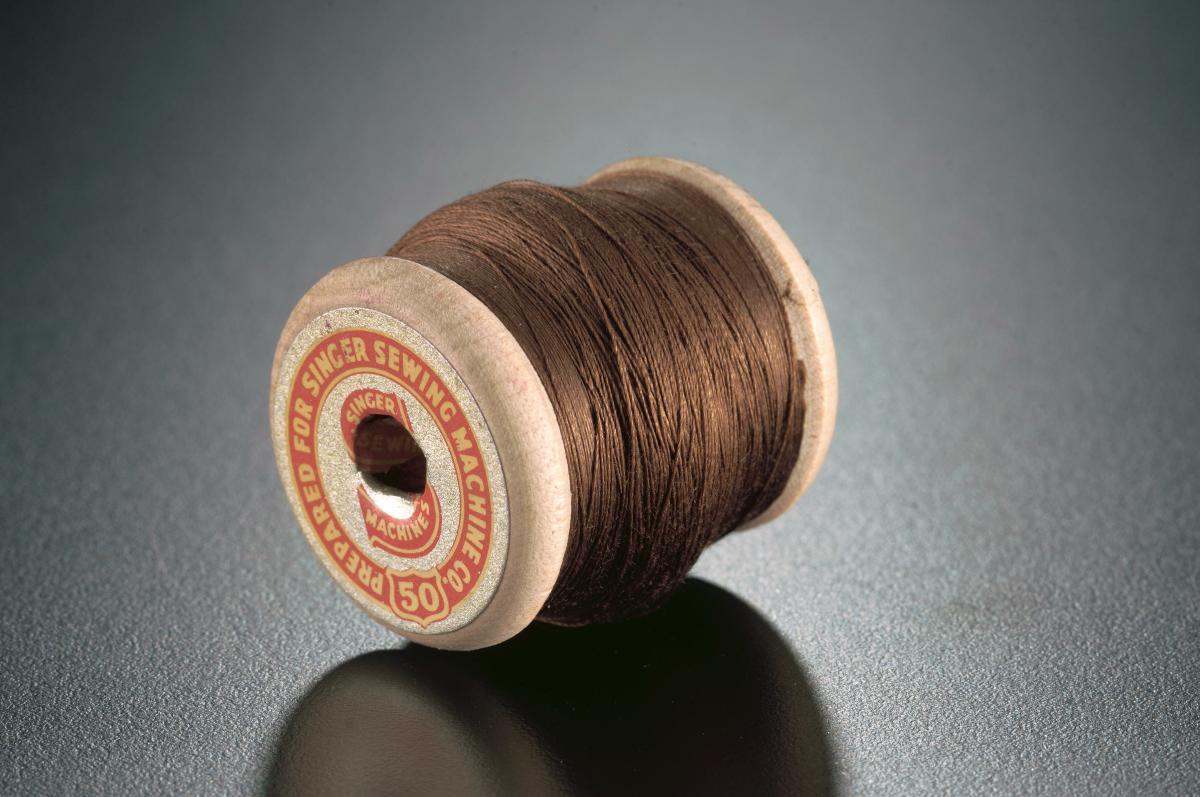 A spool of machine thread for Singer sewing machines