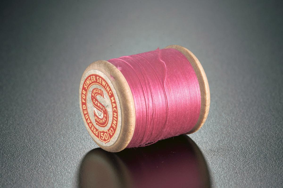 A spool of machine thread for Singer sewing machines