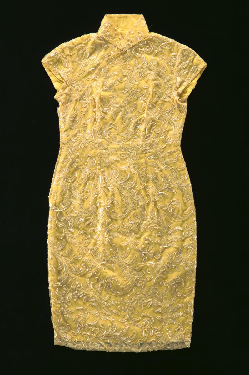 A yellow cheongsam with floral trimmings