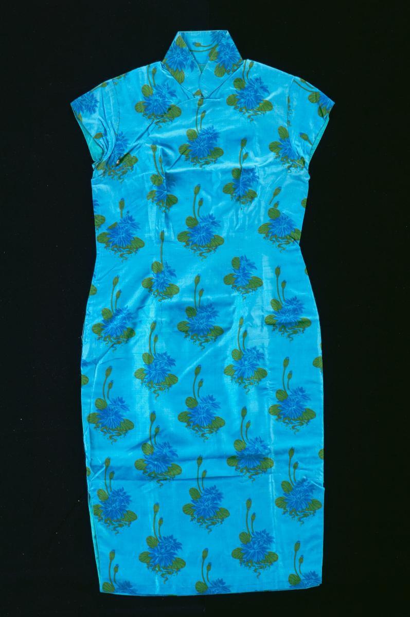 A pale cyan cheongsam with navy blue piping