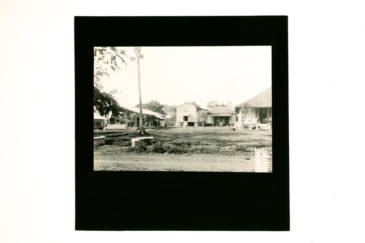 A glass lantern slide depicting a factory worker