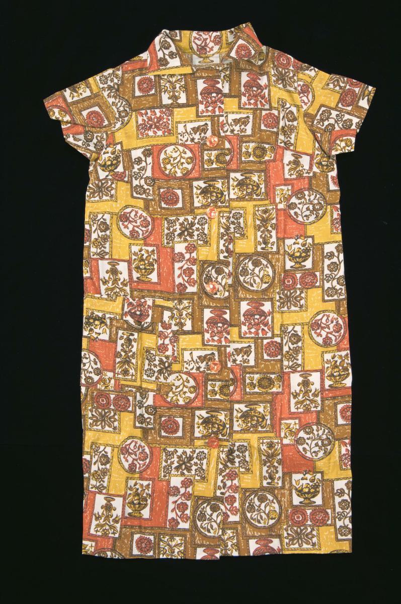 Orange and brown printed dress with a medallion motif