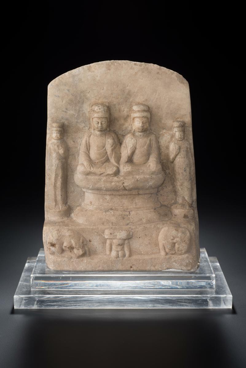 Plaque with Buddhas and attendants