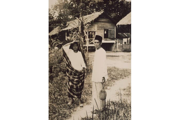 <strong>Malay couple outside their home</strong>