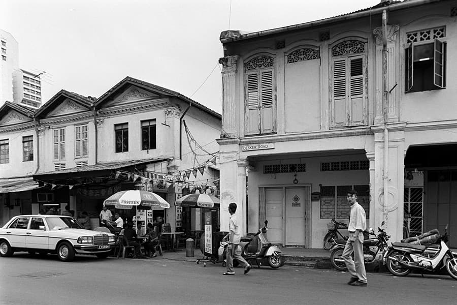 <a href="/assets/1c7bf6ec-f559-4850-a488-01456cd39fd3/desker-road.jpg"><strong>Desker Road</strong></a><br>
1994, Singapore<br>
<em>Courtesy of Lee Kip Lin and National Library Board</em>