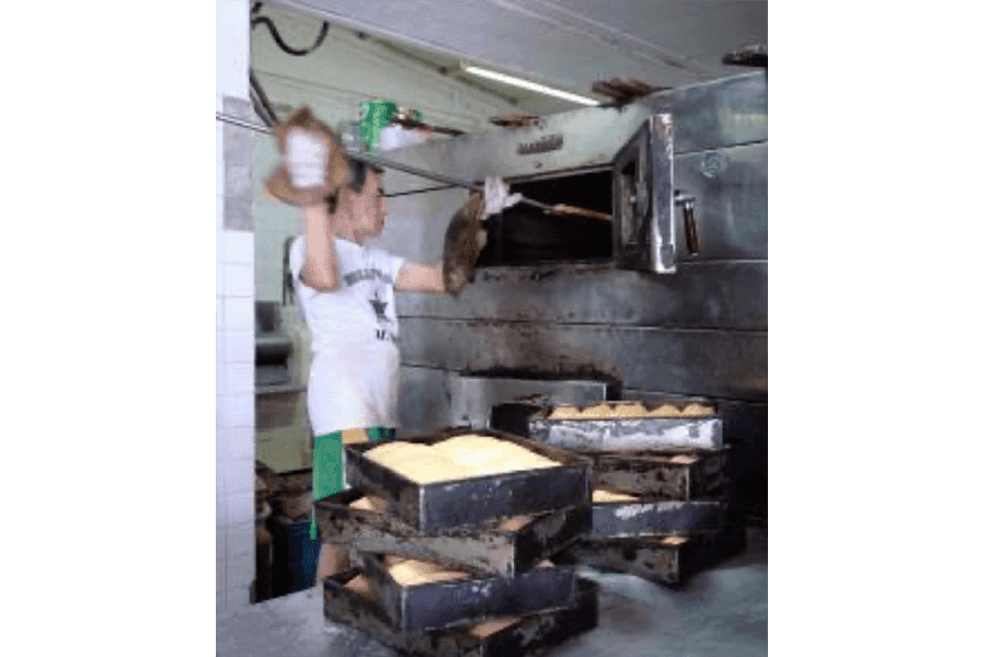 The heart of the bakery is a large rotary oven with revolving platforms that can hold up to 200 loaves of bread at a time.&nbsp;
