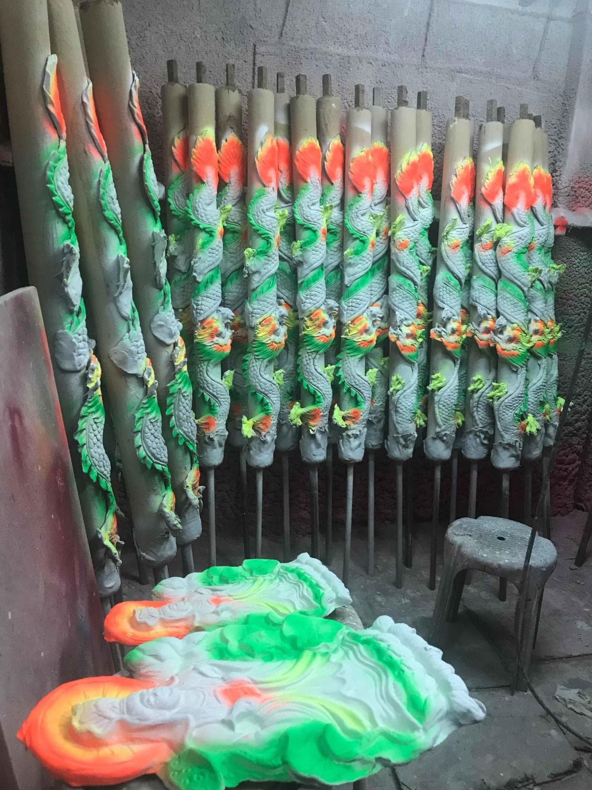 Large joss sticks being painted.