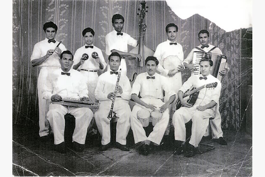 <a href="/assets/a70c08c7-40ae-44f7-b7d1-7857f4ef1506/simp.jpg"><strong>Photograph of Singapore Indian Music Party (SIMP) and the Edmund Appau Family band</strong></a><br>
1940s&ndash;1950s and 1970s, Singapore<br>
<em>Collection of the Family of Edmund Appau</em>