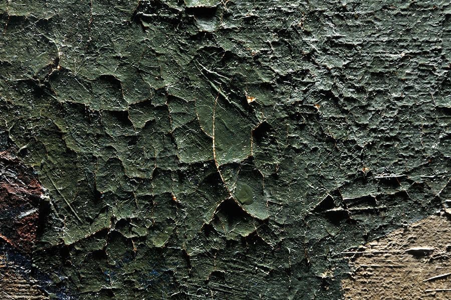 <strong>Damage: Craquelure and lifting paint seen on artwork before treatment</strong>