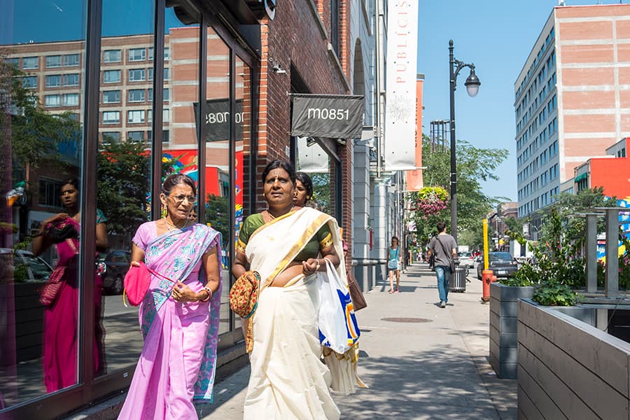 <a href="/assets/5fa344ea-0d87-4e0c-a83f-4c45fa089feb/13-montreal-quebec.jpg"><strong>Indian ladies clad in saris in Montreal, Quebec, Canada</strong></a><br>
<em>Courtesy of Phil Roeder via Creative Commons</em>