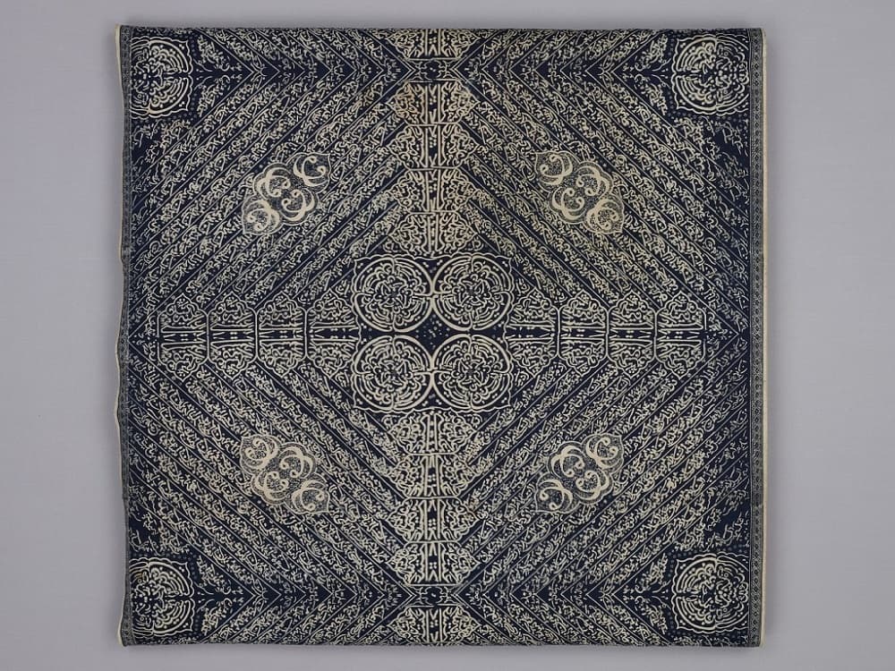 <p style="text-align: center;"><a href="https://www.roots.gov.sg/Collection-Landing/listing/1225119"><strong>Calligraphic batik</strong></a><br> 2009-02990<br> Early to mid-20<sup>th</sup> century<br> Jambi, Indonesia<br> Collection of Asian Civilisations Museum