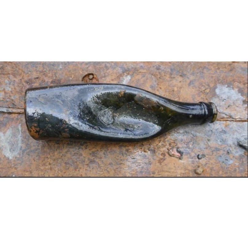 <em>Melted glass bottle</em>