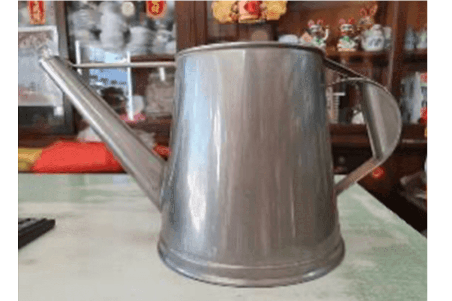 Brewers of traditional coffee usually use coffee pots such as this, which has a long spout that makes it easy to pour coffee quickly into many cups.