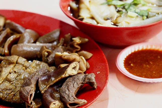 Kway chap is a dish comprising broad rice noodles in a broth served with a variety of braised sides. Image courtesy of Kyle Lam.